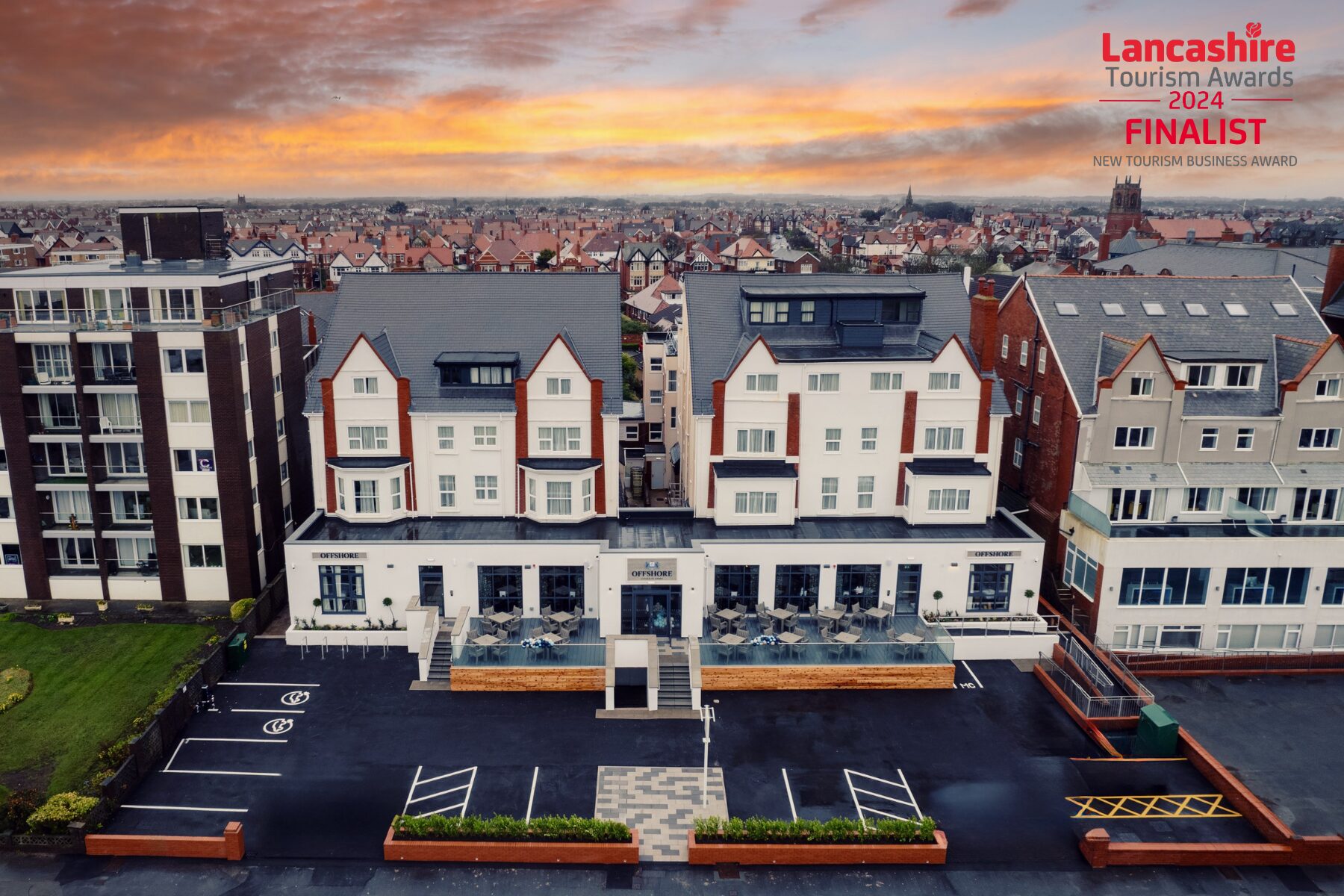 A white fronted building photographed from the air